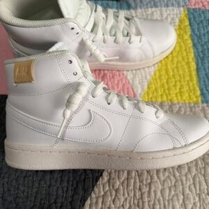 Nike White High-Top Sneakers with Gold Logo Patch